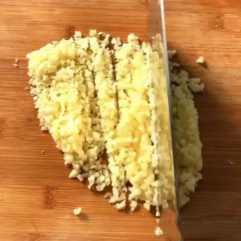 Cut the garlic and ginger into very fine sizes and crush it using mortar and pestle 2