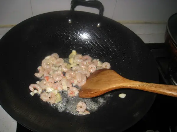 Pour in the shrimps and stir-fry