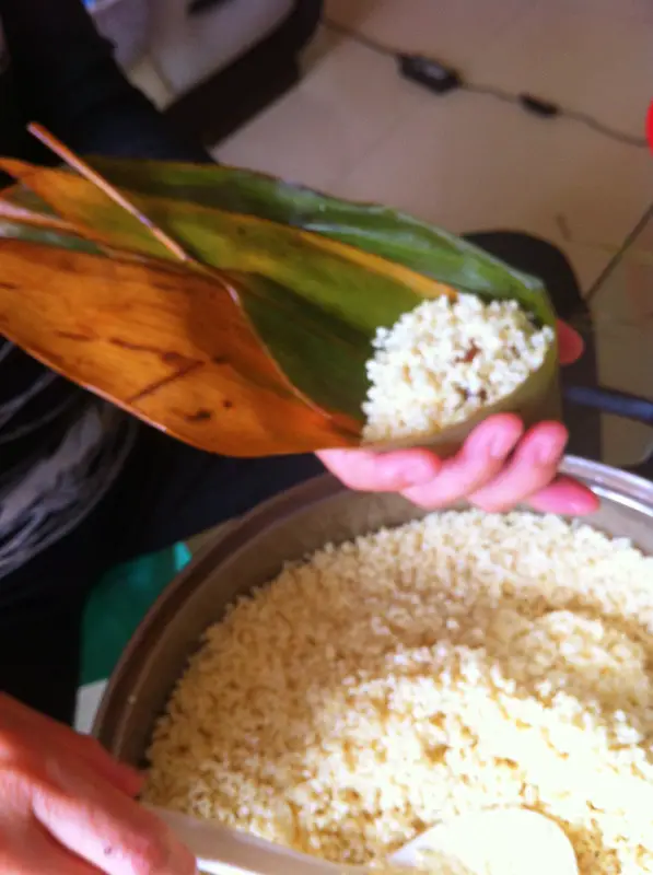 Then ladle in some glutinous rice, about eight or nine times full.