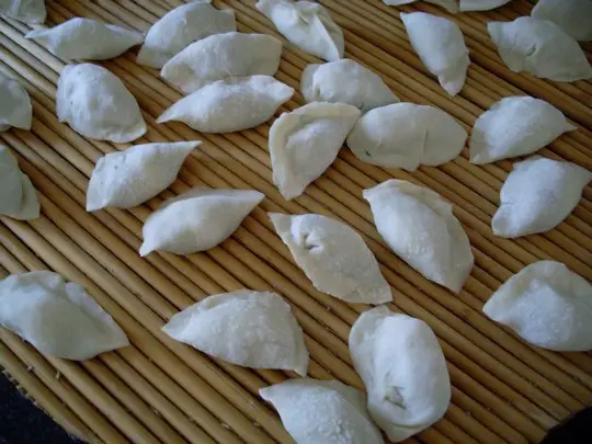 Make dumpling skins and stuffing into dumplings.