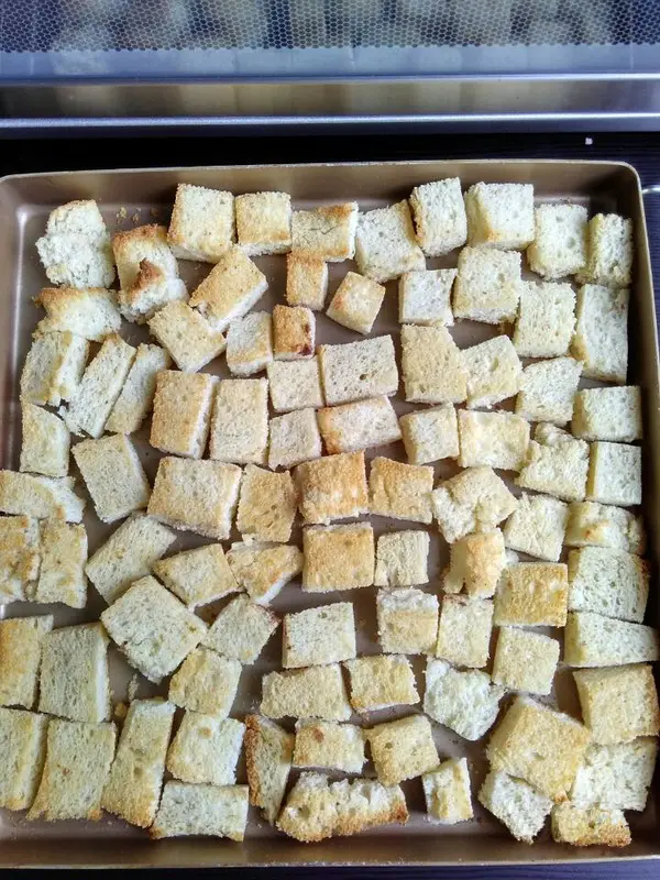 Until the bread cubes are slightly sallow