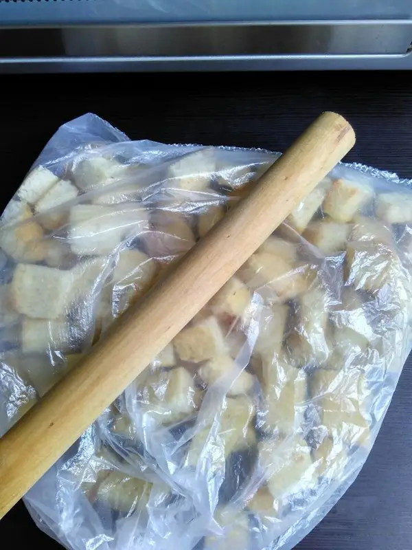 put them into a grocery bag, and roll it with a rolling pin